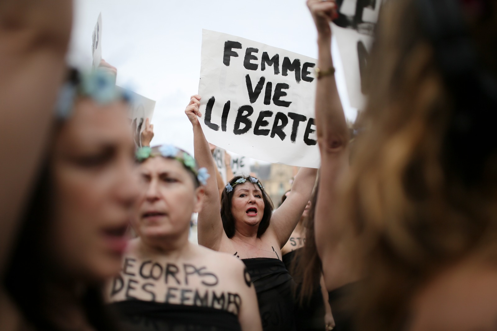 100 Women in FEMEN Action against Violence against Women